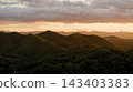 Mountain range illuminated by the setting sun Mountain range illuminated by the setting sun 143403383