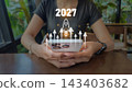2027 rocket launch future growth concept with smartphone and holographic icons for innovation templates 143403682