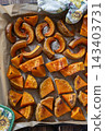 Roasted pumpkin slices on baking tray. 143403731