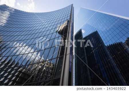 Curved glass facade of modern skyscraper Curved glass facade of modern skyscraper 143403922