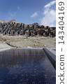 Solar panels lying on ground with vertically mounted four wings around central column, photovoltaic plant avoid snow accumulation, maintain high yields, Alps, future innovation energy concept 143404169
