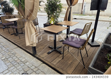 Charming Street Cafe Patio for Outdoor Dining and Relaxation Charming Street Cafe Patio for Outdoor Dining and Relaxation 143404339