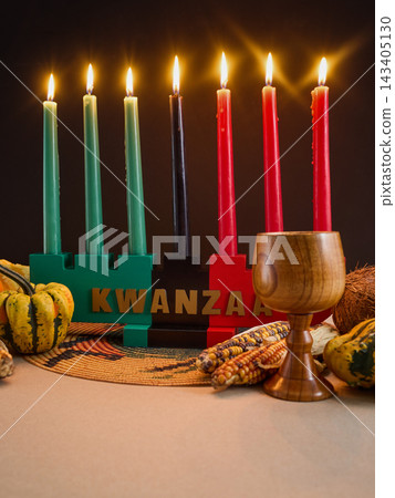 Kwanzaa kinara holding seven lit mishumaa saba candles Kwanzaa kinara holding seven lit mishumaa saba candles 143405130