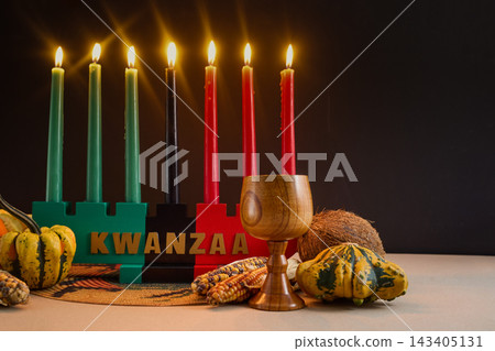Kwanzaa celebration with lit mishumaa saba candles and kinara Kwanzaa celebration with lit mishumaa saba candles and kinara 143405131