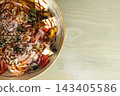 Fresh salad bowl with red onion feta olives and sesame seeds on 143405586