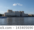 10 August 2026 Russia Moscow riverboat sailing along the Moskva River with the historic Ministry of Defense building on Frunzenskaya Embankment in the background 143405690