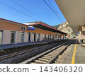 Railway station of Finale Ligure Marina (Ligurian Coast) with mountains in the background. Finale Ligure is beautiful seaside town and popular resort on Ligurian Riviera in Italy 143406320