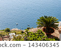 Aerial View from Ravello overlooking the Amalfi Coast in Italy. Aerial view of terraced fields, lush greenery, and the Mediterranean Sea 143406345