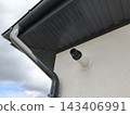 Gas boiler's ventilation pipe is sticking out of the wall of the hous 143406991