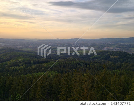 Vast sunset scenery. Grand view of evening hills. Sprawling sunset over rolling landscapes and villages Vast sunset scenery. Grand view of evening hills. Sprawling sunset over rolling landscapes and villages 143407771