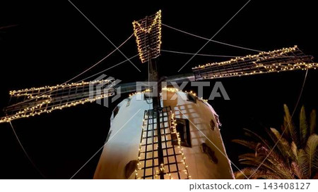 The Illuminated Windmill at Night captivates visitors with its breathtaking beauty and artistry The Illuminated Windmill at Night captivates visitors with its breathtaking beauty and artistry 143408127