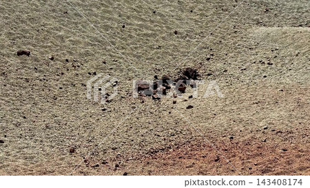 An Aerial View Capturing the Unique and Textured Terrain Featuring Distinct Rock Formations An Aerial View Capturing the Unique and Textured Terrain Featuring Distinct Rock Formations 143408174