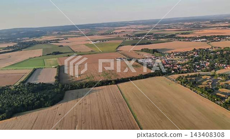 Aerial View of the Lush Agricultural Fields and Beautiful Woodlands in the Countryside 143408308