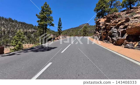 Embarking on a scenic road journey through enchanting pine forests brings joy and peace Embarking on a scenic road journey through enchanting pine forests brings joy and peace 143408333