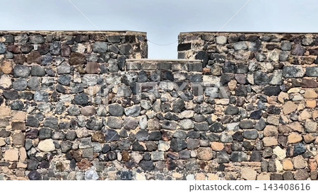 An exquisite Rustic Stone Wall featuring a Window along with various Architectural Features An exquisite Rustic Stone Wall featuring a Window along with various Architectural Features 143408616