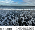 The sea of Enoshima crashing against the sandy beach 143408805