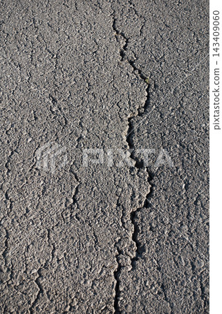 Cracked Asphalt Surface Texture and Abstract Background Cracked Asphalt Surface Texture and Abstract Background 143409060