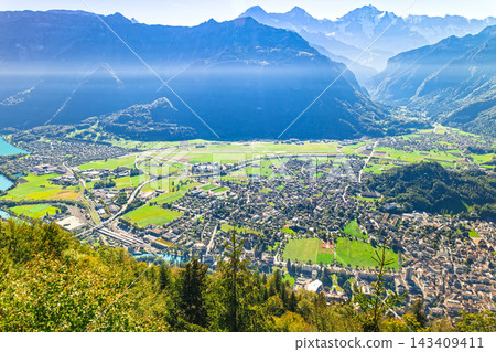 The townscape of Interlaken as seen from the Harder Kulm viewpoint in Switzerland. The townscape of Interlaken as seen from the Harder Kulm viewpoint in Switzerland. 143409411