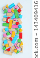 Multicolored Wooden and Plastic Toy Building Blocks Flat Lay Background 143409416