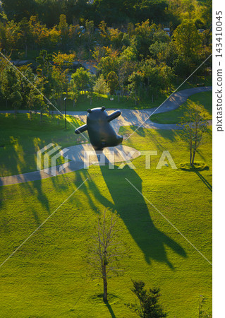 Yatsushiro, Kumamoto Pref, Japan - Oct 9 2024, vertical aerial view of giant Kumamon bear sculpture, mascot of Kumamoto Prefecture, located in a park in Yatsushiro Port, at daytime, Yatsushiro, Japan Yatsushiro, Kumamoto Pref, Japan - Oct 9 2024, vertical aerial view of giant Kumamon bear sculpture, mascot of Kumamoto Prefecture, located in a park in Yatsushiro Port, at daytime, Yatsushiro, Japan 143410045