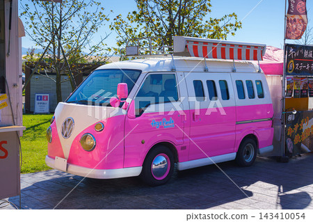 Yatsushiro, Kumamoto Pref, Japan - Oct 9 2024, close-up view of a parked kei car decorated like a pink Volkswagen minivan, without people, at daytime, Yatsushiro, Japan Yatsushiro, Kumamoto Pref, Japan - Oct 9 2024, close-up view of a parked kei car decorated like a pink Volkswagen minivan, without people, at daytime, Yatsushiro, Japan 143410054