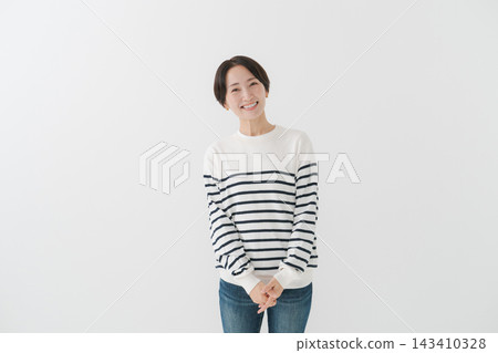 A casual portrait of a woman in her 40s. A casual portrait of a woman in her 40s. 143410328