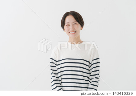 A casual portrait of a woman in her 40s. A casual portrait of a woman in her 40s. 143410329