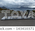 The TOYA monument at the silo observation deck and a panoramic view of Lake Toya 143410371