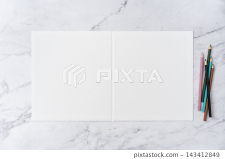 Top view sequence from open to close blank white greeting card mockup on marble background with copy space : colored pencils on opened blank white greeting card 143412849
