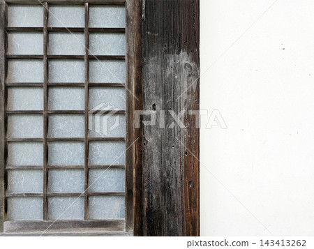 Traditional Japanese Shoji Paper Screen Window Frame with Weathered Wood and White Wall. 143413262