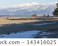 The snow-covered Tateyama mountain range viewed across Toyama Bay in winter. 143416025