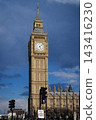 The beautiful clock tower of Big Ben, a World Heritage Site, against a blue sky - London 143416230