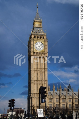 The beautiful clock tower of Big Ben, a World Heritage Site, against a blue sky - London The beautiful clock tower of Big Ben, a World Heritage Site, against a blue sky - London 143416230