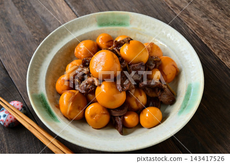 Braised chicken gizzards and chicken hearts served on a round Japanese plate. Braised chicken gizzards and chicken hearts served on a round Japanese plate. 143417526