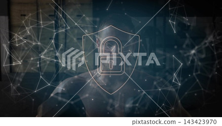 Sitting male wearing dark jacket facing screen in office, with shield padlock and node lines Sitting male wearing dark jacket facing screen in office, with shield padlock and node lines 143423970