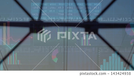 Projecting financial charts across glass panes with X-shaped brace at atrium, with numeric grid Projecting financial charts across glass panes with X-shaped brace at atrium, with numeric grid 143424938