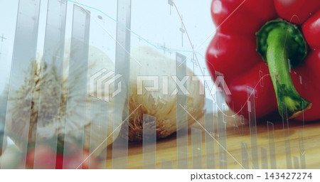 Displaying garlic bulbs and red bell pepper sitting on wood cutting board, showing financial charts Displaying garlic bulbs and red bell pepper sitting on wood cutting board, showing financial charts 143427274