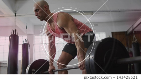 Lifting bald man gripping loaded barbell at gym in coral tank and dark shorts, circular overlay Lifting bald man gripping loaded barbell at gym in coral tank and dark shorts, circular overlay 143428521