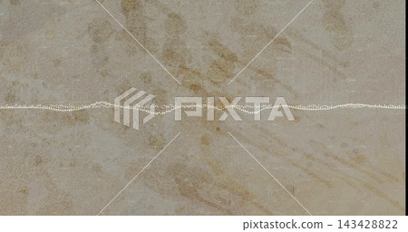 Displaying stone slab in close-up with white dotted waveform line across center, dark edges Displaying stone slab in close-up with white dotted waveform line across center, dark edges 143428822