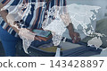 Packing senior woman striped blouse arranging suitcase on bed, phone showing QR, worldmap overlay 143428897