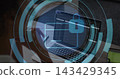 Displaying open laptop running code at home office desk, showing padlock icon and green tablet 143429345