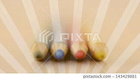 Displaying four hex wooden colored pencils lined on sunburst paper with green blue red yellow cores Displaying four hex wooden colored pencils lined on sunburst paper with green blue red yellow cores 143429881