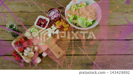 Displaying wooden board and white bowl showing salad ingredients on wood tabletop, magenta overlay Displaying wooden board and white bowl showing salad ingredients on wood tabletop, magenta overlay 143429892