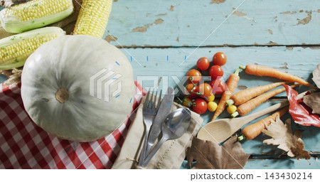 Displaying pale green pumpkin sitting on teal table, with gingham cloth, husked corn and cutlery Displaying pale green pumpkin sitting on teal table, with gingham cloth, husked corn and cutlery 143430214