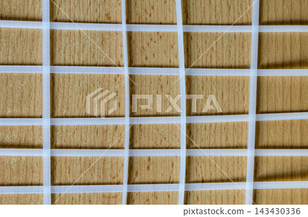 Wooden surface with white grid pattern and lines Wooden surface with white grid pattern and lines 143430336
