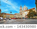 The medieval atmosphere of Malá Strana Square in Prague, the capital of the Czech Republic, along with the scenery of trams and churches. 143430980