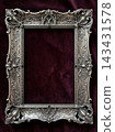 Elegant ornate silver frame with intricate victorian gothic design against dark background 143431578