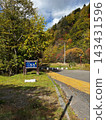 A signpost and autumn scenery at "Sankai Falls," a scenic spot in Otaki district, Date City, Hokkaido. 143431596