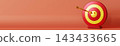 A target symbol is placed on a plain surface representing finance. An arrow is hitting the center, showing achievement. There is room for text around 143433665