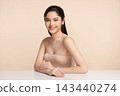 Beautiful Young transgender woman with clean fresh skin on beige background, Face care, Facial treatment, Cosmetology, beauty and spa, transgender women portrait. 143440274